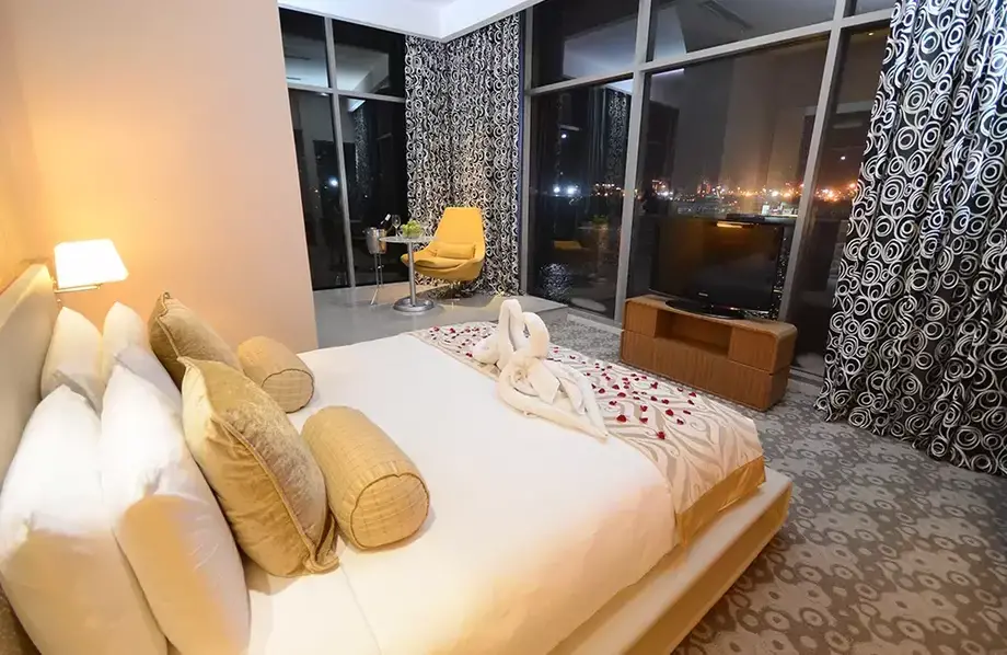 Executive Suite in Hotel H2O Manila with the view of Manila Bay at night