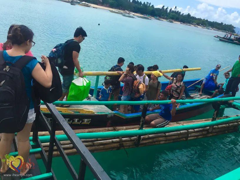 Transferring to a flat boat from our ferry from Mauban to Cagbalete Island