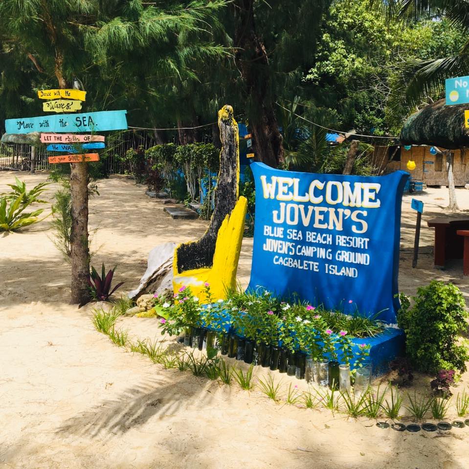 Beachfront with welcome signage at Joven's Resort